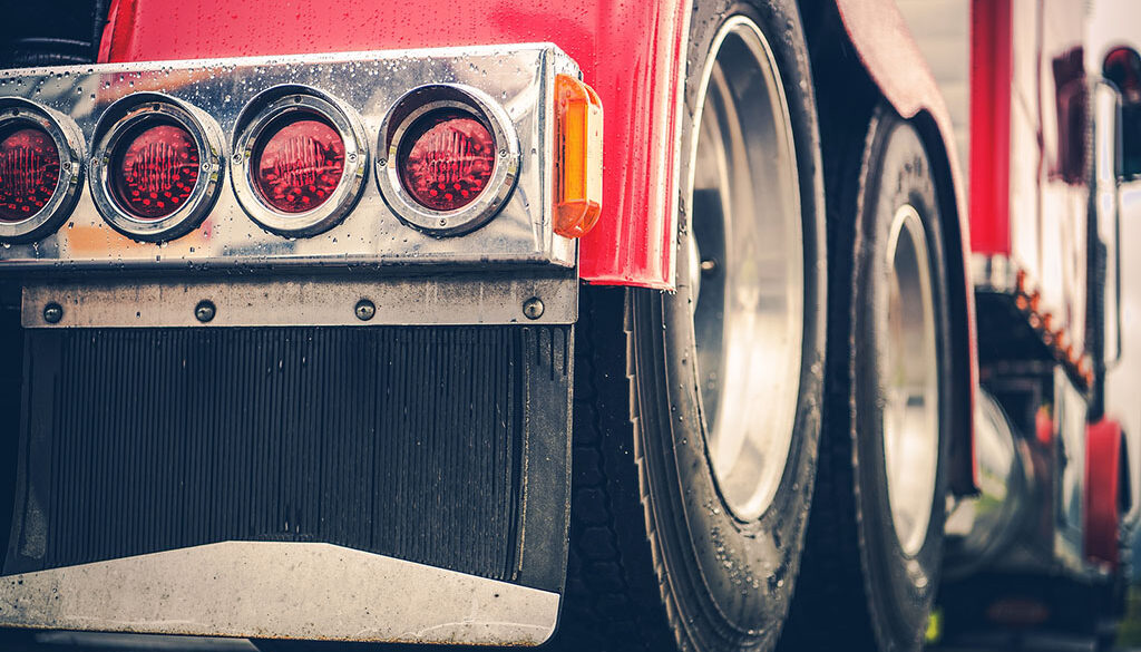 Closeup of the Rear Tires and Lights of a Custom Hopper Bottom Trailer