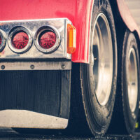 Closeup of the Rear Tires and Lights of a Custom Hopper Bottom Trailer