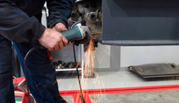 Closeup of a Mechanic Welding a Part During a Trailer Service Pinnacle Trailers’ After-Sales Service